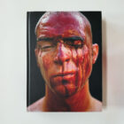 Cover of IRR/RESPEKTIV by South African artist Kendell Geers, featuring a red portrait with bold white typography