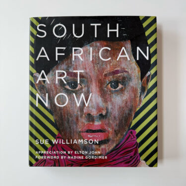 Front cover of the book "South African Art Now" by Sue Williamson. The cover features a striking, colorful portrait of a woman with short hair and a pink scarf against a yellow and black striped background.